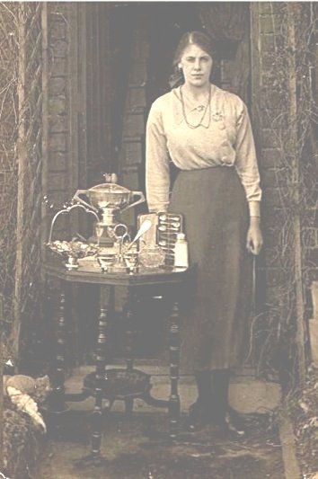 Peggy Rooney with swimming trophies